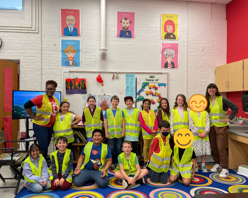 Teachers and students with reflective vests