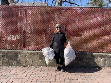 A volunteer with a big bag of litter collected on Abingdon's grounds