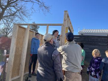 Volunteers building a garden shed